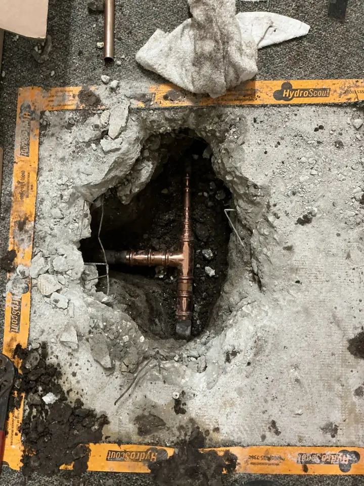 New copper tee installed in an opened concrete slab during a Flow Pros slab leak repair in Clearwater, FL