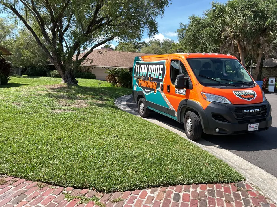 Flow Pros Plumbing service van parked at a home in Clearwater, FL
