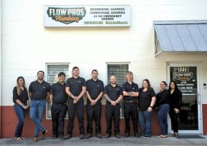 Flow Pros Team Photo With Building