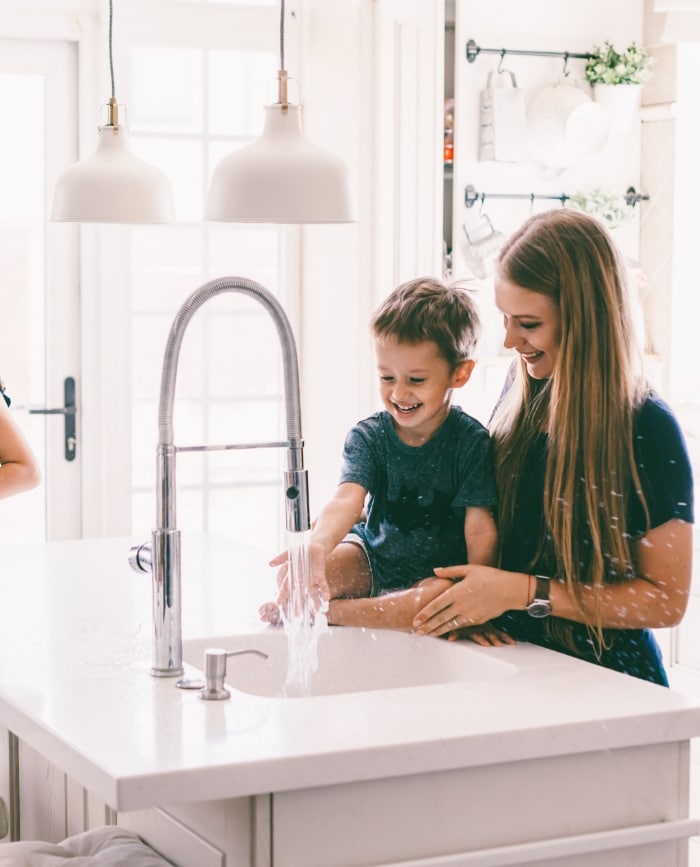 Mom And Son At Kitchen Sink 1